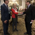 President Derick Malis and wife, Inta, greet Ray Bednarsky