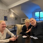 Inta and Derick Malis teaching Joyce how to play Euchre