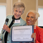 At the 2023 Winter Luncheon, Patricia Brennan gives the LLI Meritorius Service Award to Anna Dixon